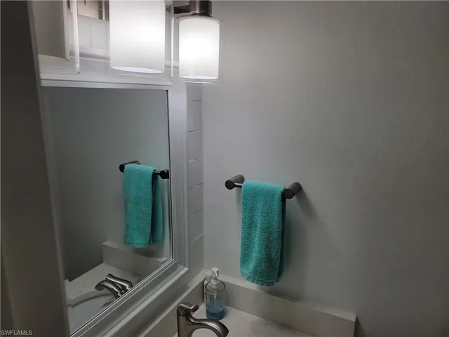 Bathroom featuring vanity and baseboards