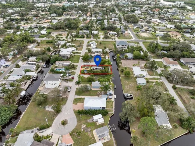 Aerial overview of property's location featuring nearby suburban area