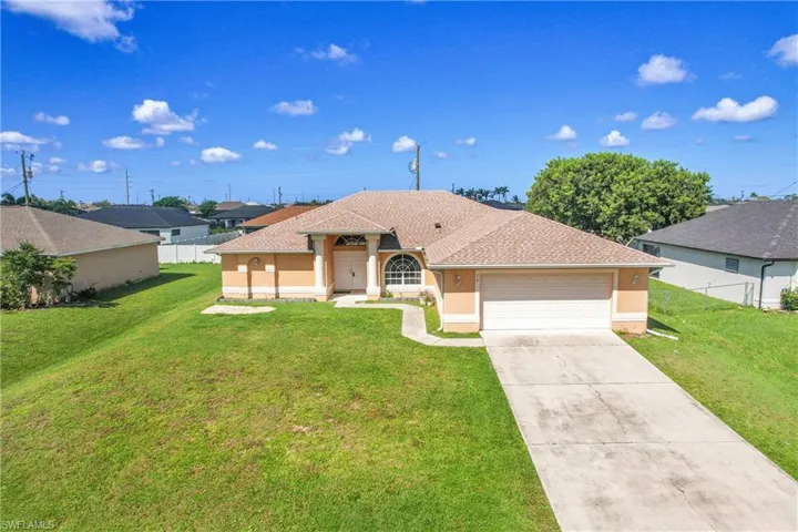 View of front of house featuring stucco siding, concrete driveway, roof with shingles, and an attached garage