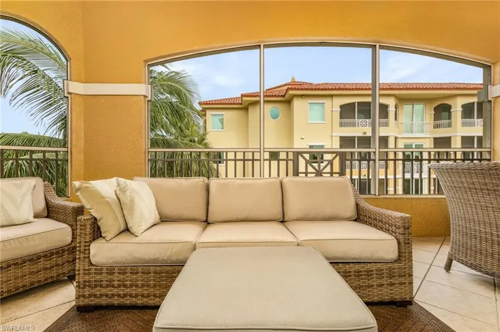 Living room with a wealth of natural light and tile floors