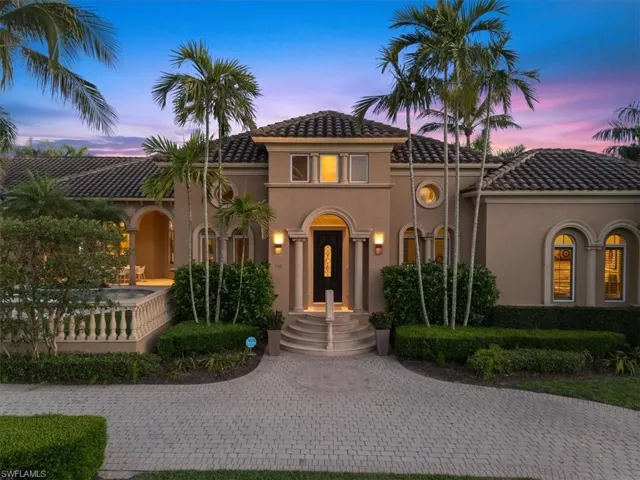Mediterranean / spanish home featuring a tiled roof, stucco siding, and covered porch