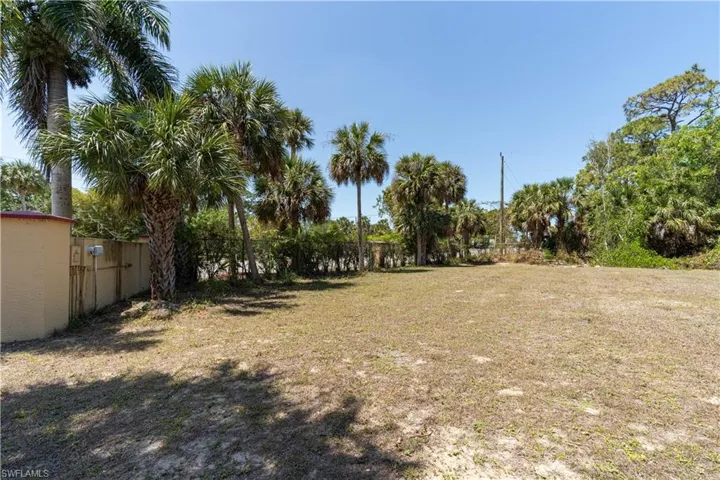 View of yard featuring fence