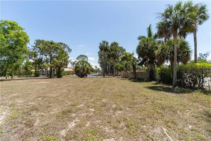 View of yard featuring fence