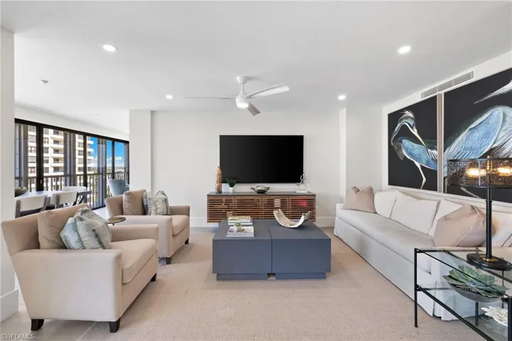 Living area with recessed lighting and a ceiling fan