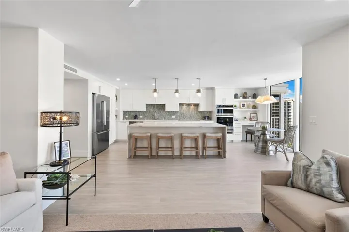 Living room featuring light wood finished floors and recessed lighting