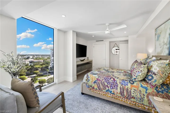 Bedroom featuring light wood-type flooring, recessed lighting, ceiling fan, access to outside, and floor to ceiling windows