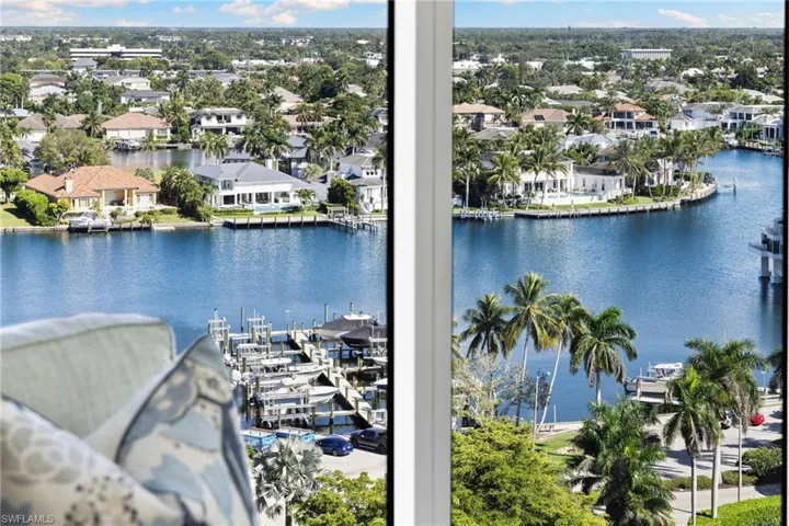 Water view featuring a dock and boat lift