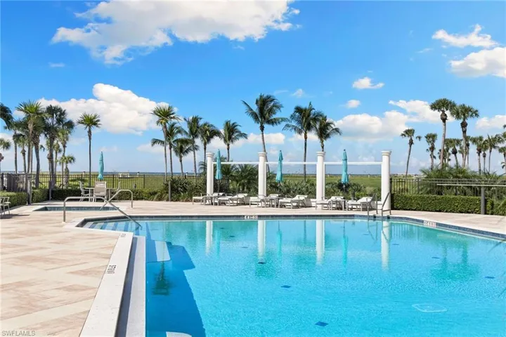 Community pool with a patio
