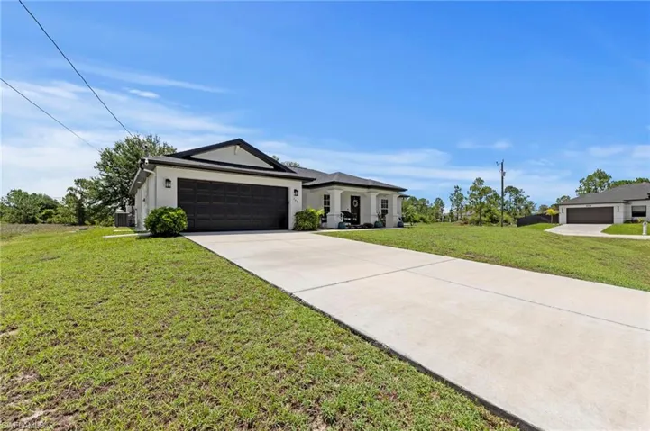 Beautiful curb appeal with fresh paint and a new roof. Situated on over a 1/2 acre of land!