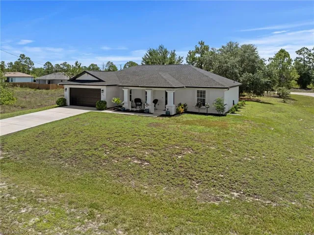 Beautiful curb appeal with fresh paint and a new roof. Situated on over a 1/2 acre of land!