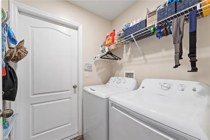 Laundry room, washer and dryer will convey with the home