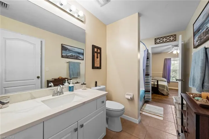 Jack and jill guest bathroom with quartz counters (Installed in 2026) and an updated toilet as well as a shower/tub combo