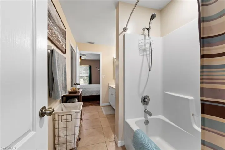 Jack and jill guest bathroom with quartz counters (Installed in 2026) and an updated toilet as well as a shower/tub combo