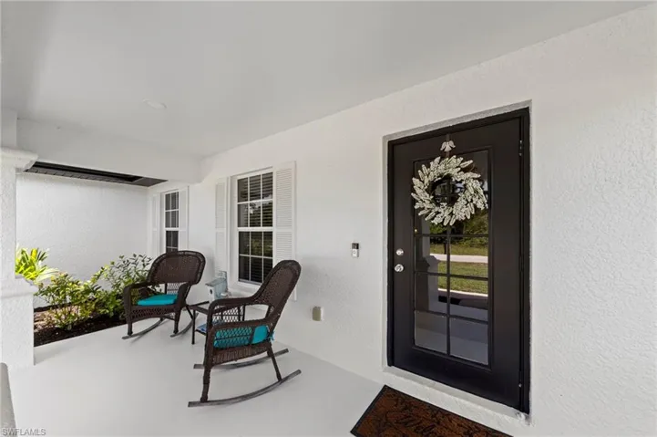 Southern style front porch with fresh paint and decorative shutter panels