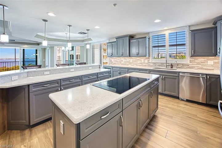 Gorgeous remodeled kitchen with island, cooktop and great view