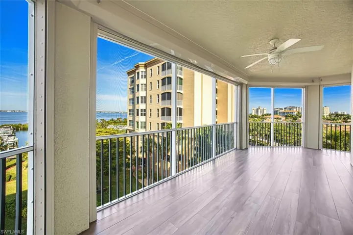 Balcony with a ceiling fan and a water view