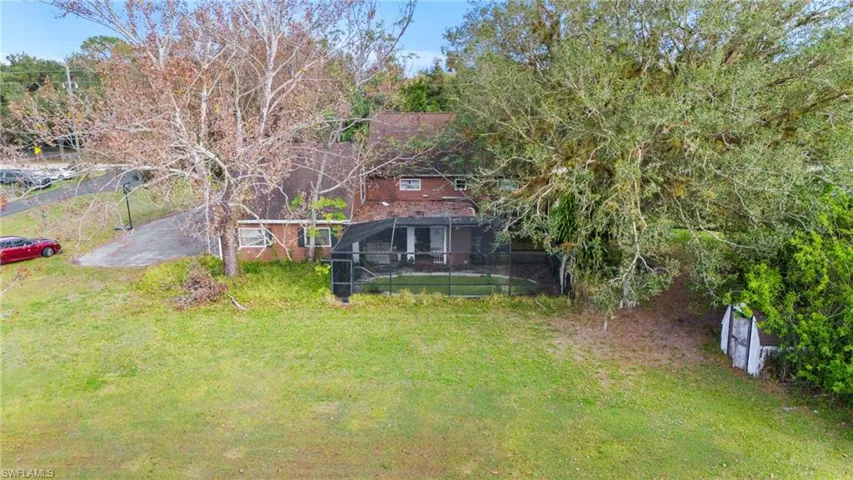 View of yard featuring a lanai