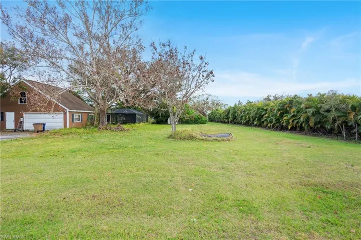 View of yard featuring a garage