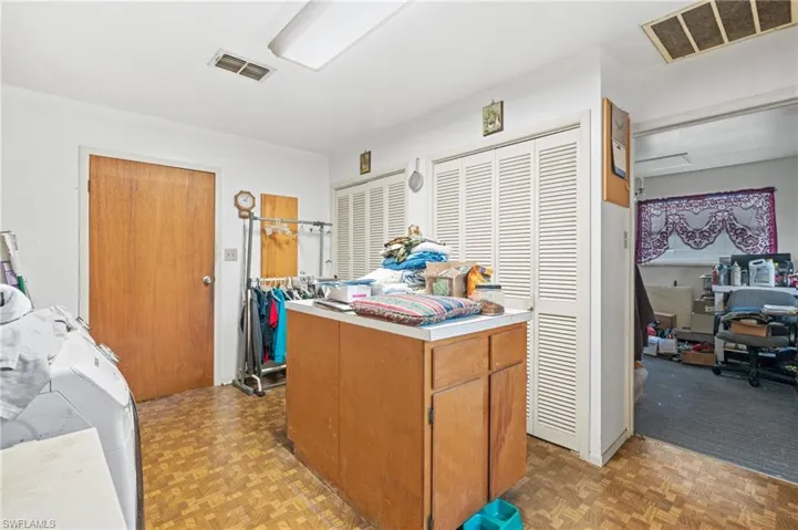 Kitchen featuring light parquet flooring and a center island