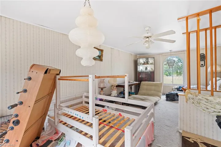 Bedroom with carpet floors and ornamental molding