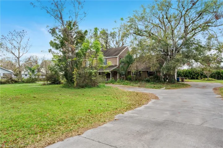 View of front of home featuring a front lawn