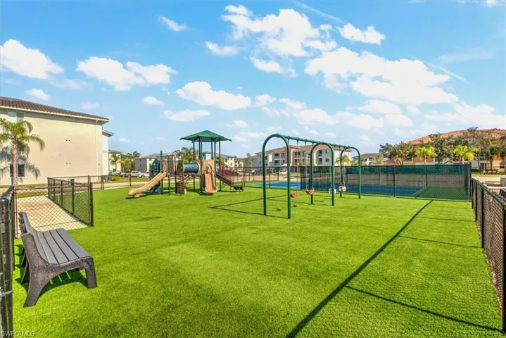 View of play area featuring a lawn