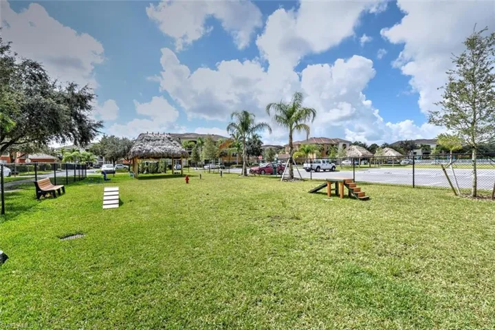 Surrounding community featuring a gazebo and a lawn