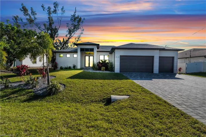 Prairie-style home with a yard and a garage