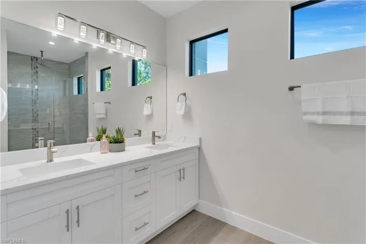 Bathroom with vanity and an enclosed shower
