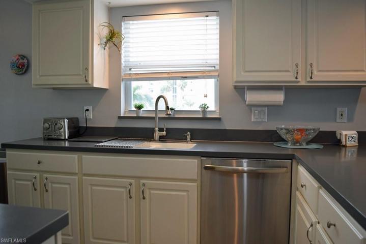 KITCHEN HAS SOLID SURFACE COUNTERTOPS.  STAINLESS STEEL APPLIANCES AND GARBAGE DISPOSAL NEW IN 2018.