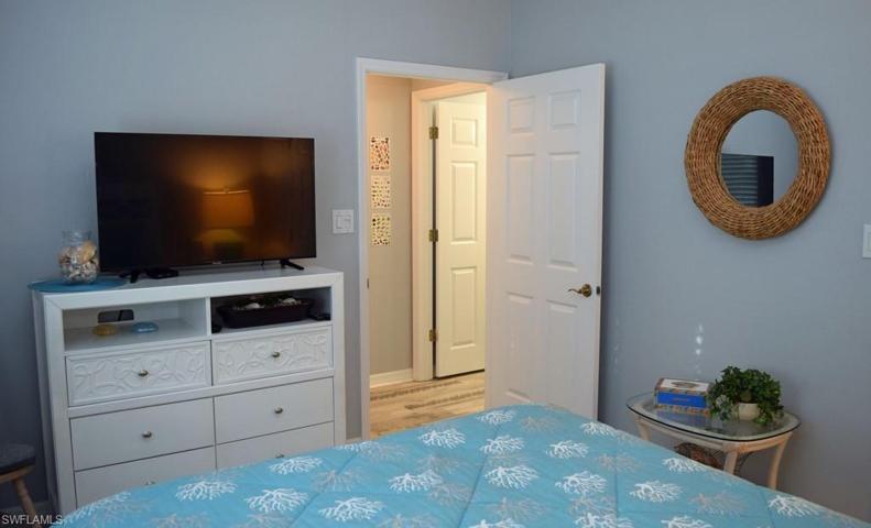 GUEST BEDROOM.  ENTRANCE TO GUEST BATH SHOWN MIDDLE REAR.