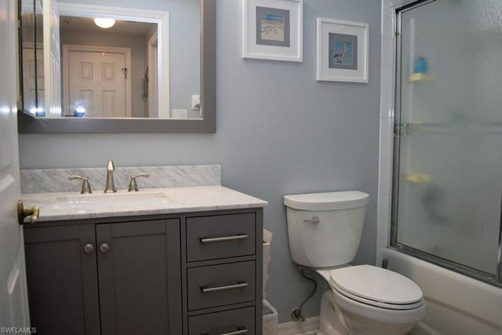 GUEST BATH.  UPDATED VANITY, MIRROR AND LIGHTING.