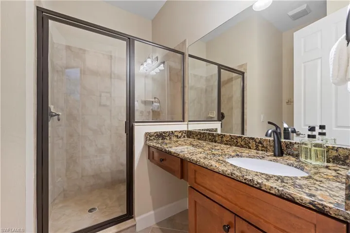 Guest Bathroom with walk-in tiled shower.