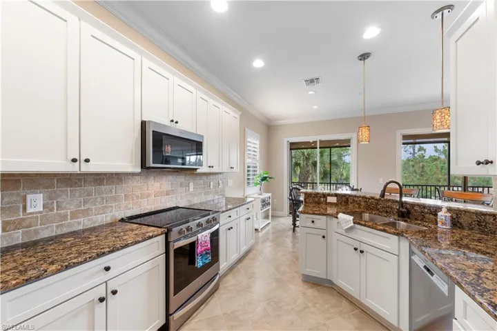 42-inch cabinets, newer stove and microwave, gorgeous ageless backsplash and solid granite countertops.