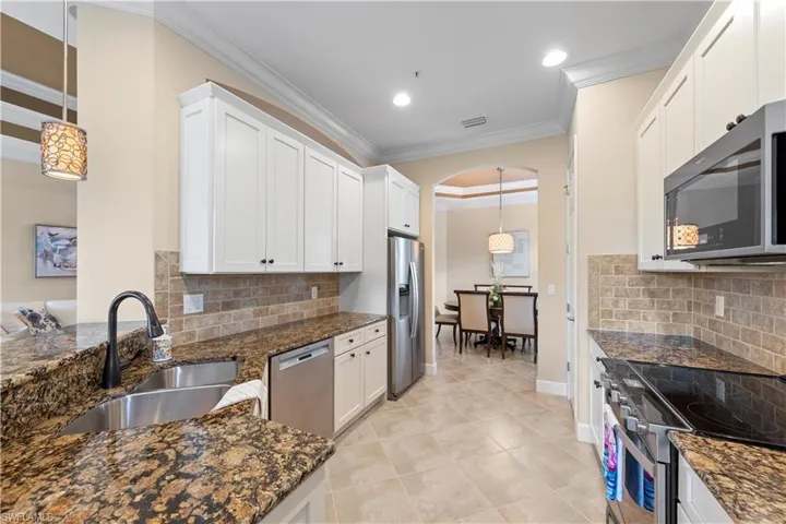 Kitchen viewing with an easy flow into another dining area.