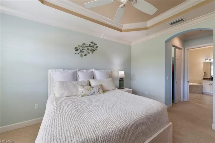 View of the entry into the Primary bathroom, and double his/hers custom closets.