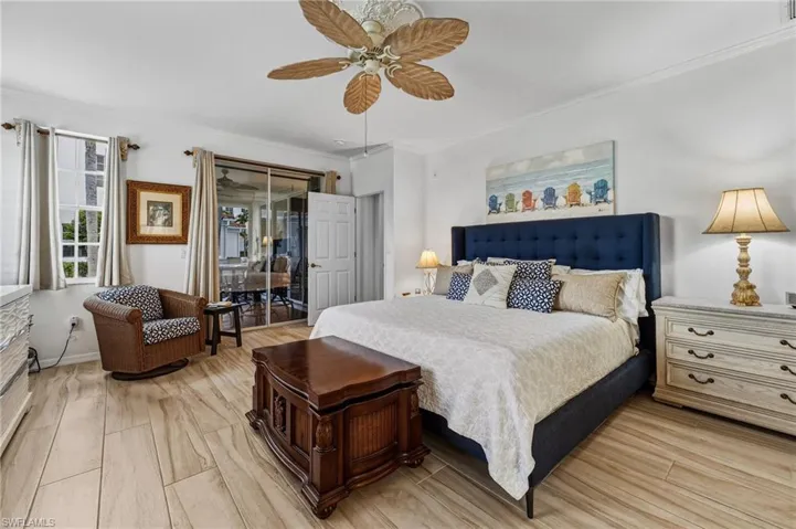 The spacious primary suite serves as a private retreat, offering direct access to the lanai for enjoying your morning coffee, abundant natural light, and a well-appointed en-suite bath.