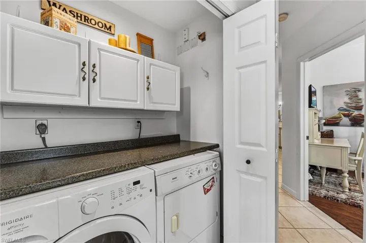 The laundry room provides additional storage for added convenience and functionality.