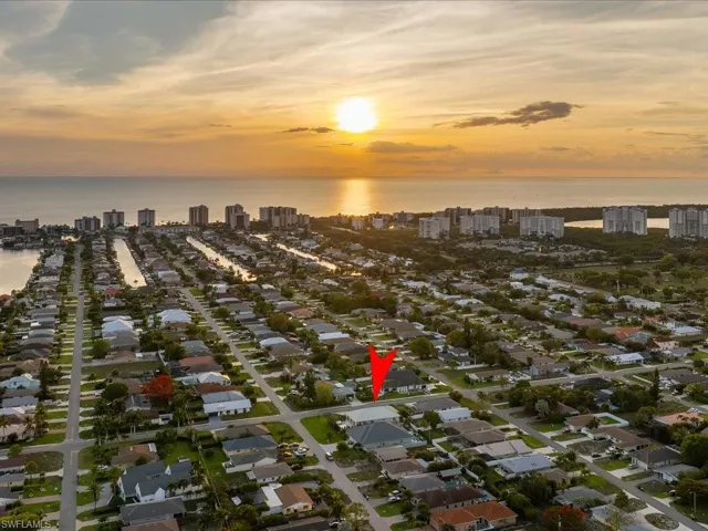 Sunset aerial looking west toward the Gulf and surrounding skyline