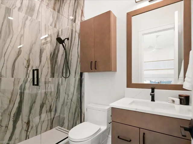 Ensuite guest bath with walk-in shower and designer tilework