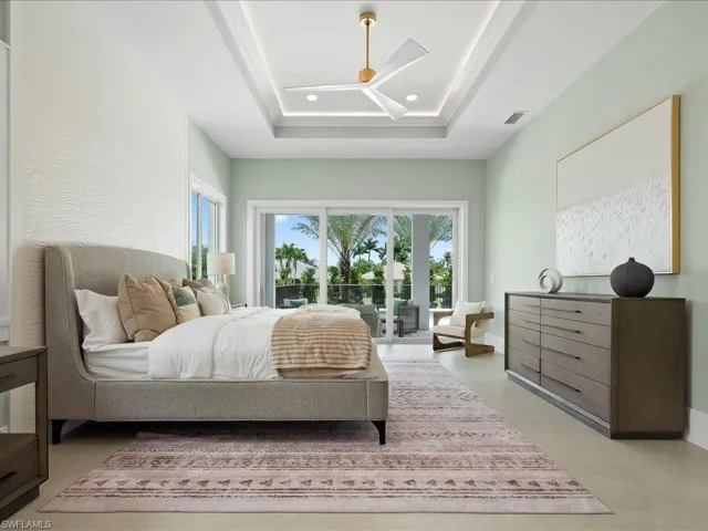Primary suite with tray ceiling and pool access