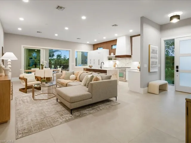 Open-concept great room with oversized sliders and natural light