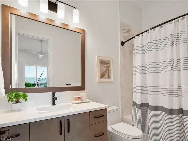 Guest bathroom with full tub and shower combination