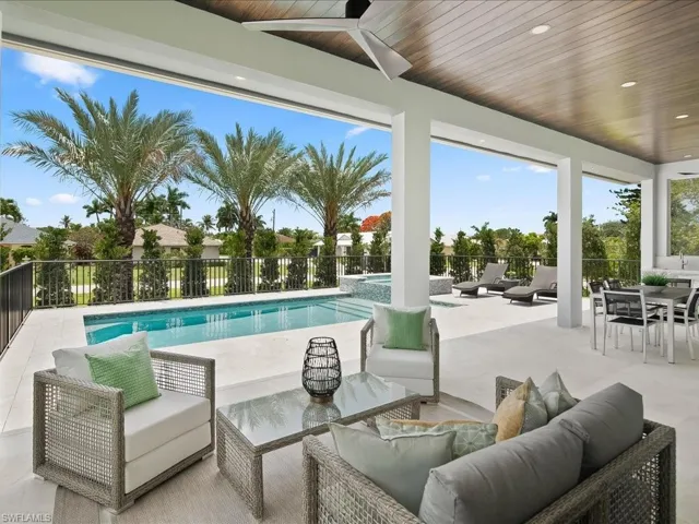 Covered outdoor living area with elevated poolside setting