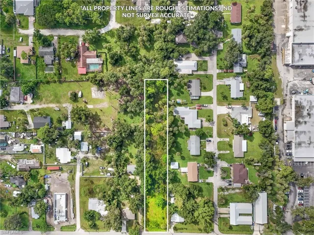 Aerial perspective of suburban area featuring property boundaries highlighted