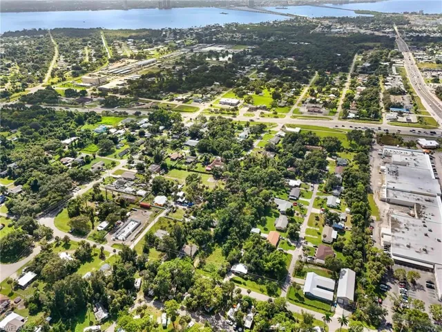 Aerial overview of property's location featuring nearby suburban area