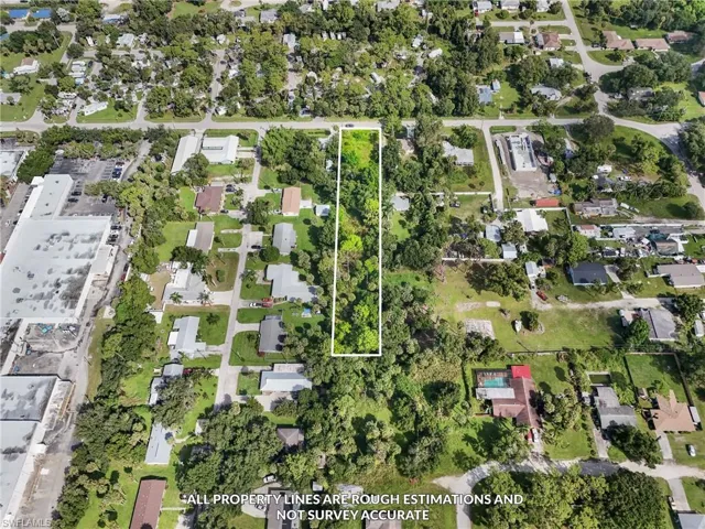 Aerial perspective of suburban area with property parcel outlined