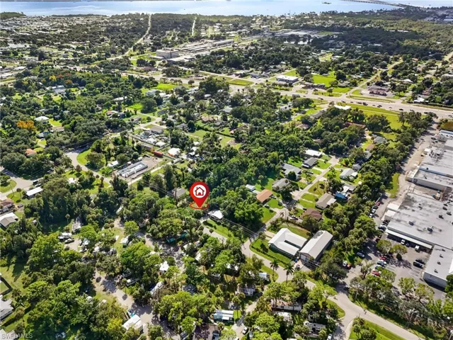 Aerial overview of property's location with a nearby body of water