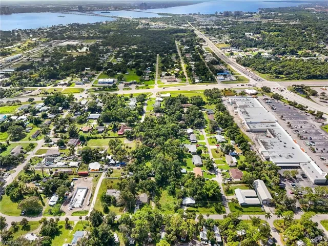 Drone / aerial view of a nearby body of water and a notable bridge