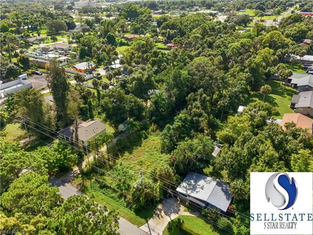 Aerial view of residential area with a tree filled landscape